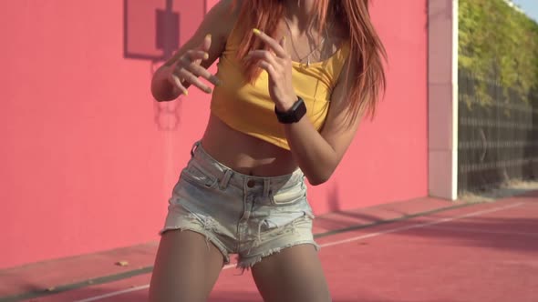 Modern Young Woman Dancing in the Street