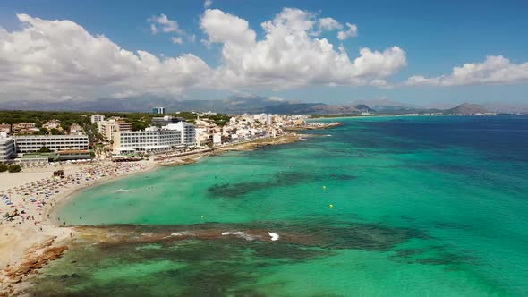 Aerial drone footage of the beach front on the Spanish island of Majorca Mallorca, Spain