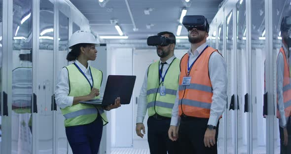 Electrical Workers in Reflective Vests Using VR