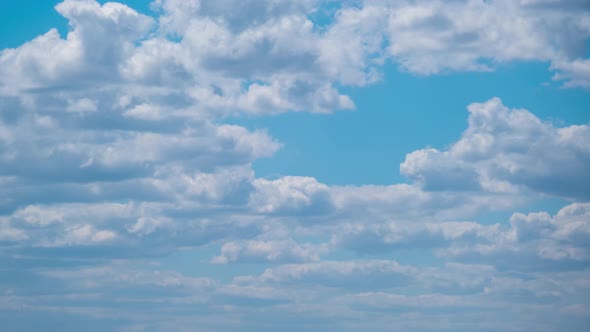 Cumulus Cirrus Clouds Move in the Blue Sky. Time Lapse