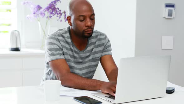 Man using laptop while woman talking on mobile phone 4k