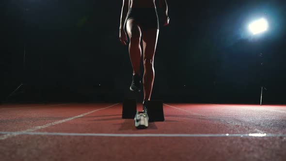 Close-up Legs of the Athlete Approach the Treadmill and Become in Position To Start the Race