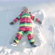 Little Girl Making Snow Angel on Sunny Winter Day - VideoHive Item for Sale