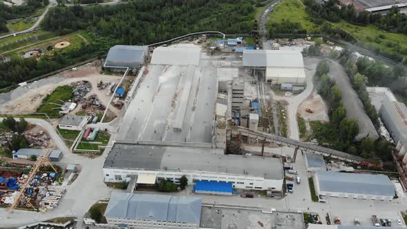Aerial view of big factory producing metal works. Metallurgy manufacture workshops