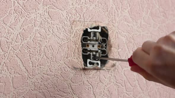 Replacing an electrical outlet when renovating a home.