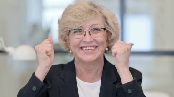 Portrait of Old Businesswoman Excited By Success Winning