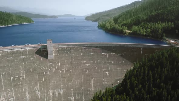 Aerial view of a large dam, blue river and forest (Hungry Horse Dam, Flathead River, Montana, USA)