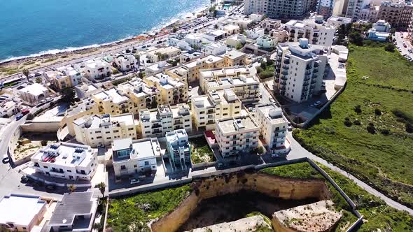 St. Paul Bay cityscape and deep building foundation nearby. Malta island. Aerial view