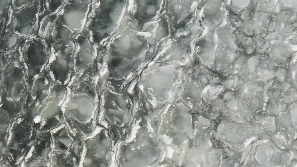 Rippling watering broken sheets of ice 4k