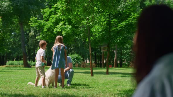 Blurred Profile Unknown Woman Looking Resting Family on Summer Picnic