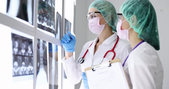 Doctor in Protective Masks is Looking at Xray of Lungs  Movie Slow Motion