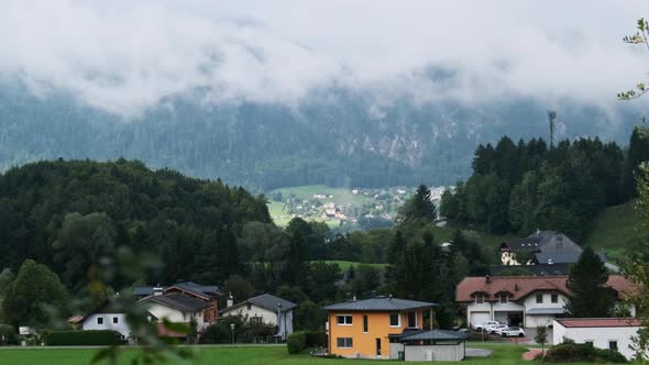 Austrian Rural Landscape with Mountains Houses and Green Lawns