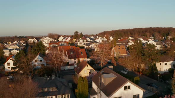 Forward Flying Drone Over Streets with Family Houses in Neighbourhood