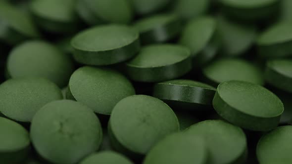 superfoods Spirulina, chlorella supplement pills close up, macro shot