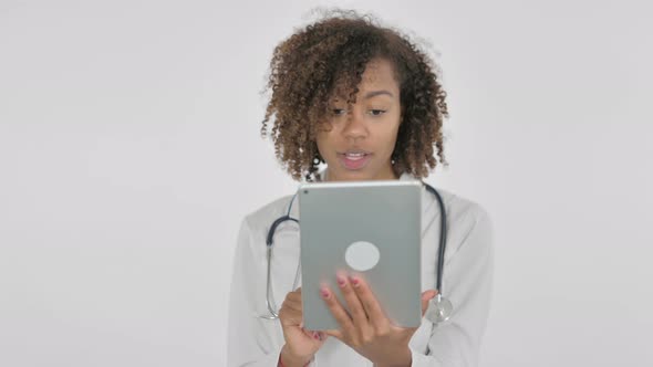 Video Call on Tablet By African Female Doctor on White Background