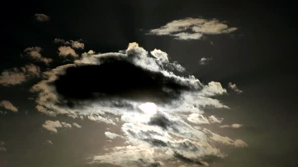 Sun Behind The Clouds In Dark Colors