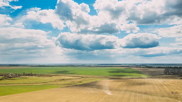 Clouds And Whirlwind Tornado Above Empty Countryside Rural Field Landscape In Spring Cloudy Day