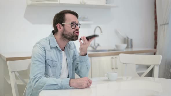 Annoyed Beard Young Man Getting Angry on Phone in Office 