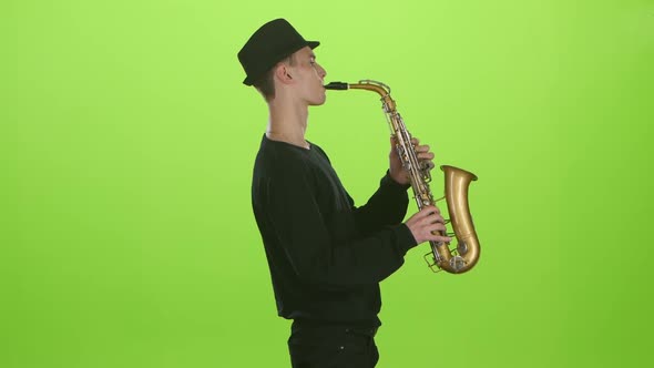 Saxophonist Playing on the Gold Musical Instrument