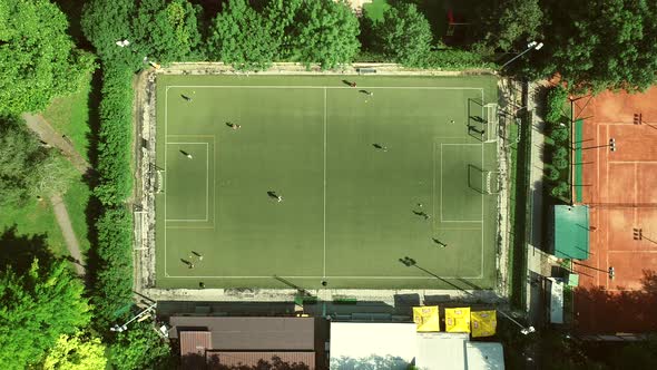 Aerial view of a football training in a football pitch on a summer day.