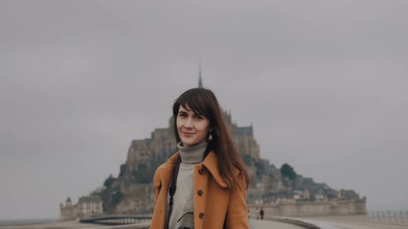 Beautiful Portrait of Smiling Caucasian Brunette Photographer Woman at Misty Mont Saint Michel