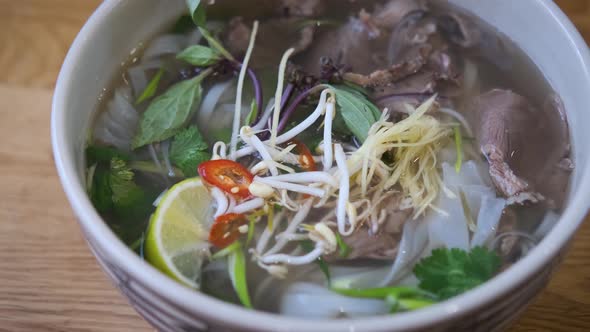 plate with vietnamese pho-bo dish