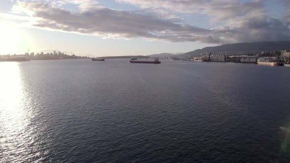 Aerial panoramic view of Vancouver harbour and ships with city skyline in background. Canada