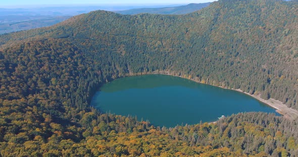 Lake Sfanta Ana - Saint Anne Crater Lake With Dense Forest On A Sunny Day In Autumn Season In Romani