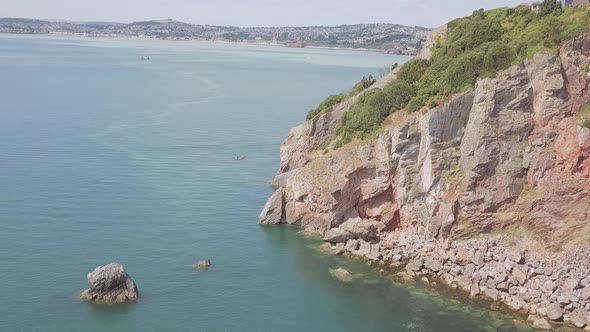 Aerial reveal of a beautiful city off the coast of the English Channel.