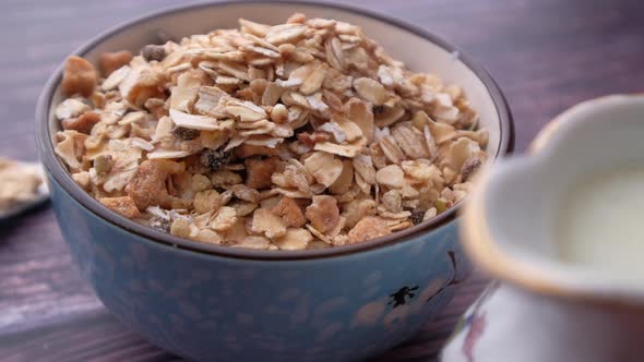 Oats Flakes and Milk Black Background, Close Up 