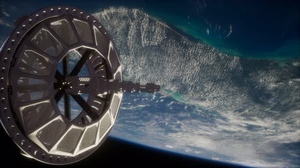 Futuristic Space Satellite Orbiting the Earth alt