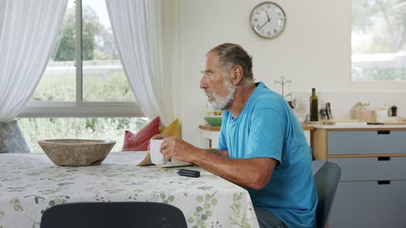 Man with Parkinson's disease using medical Cannabis in vaporizer to stop shaking