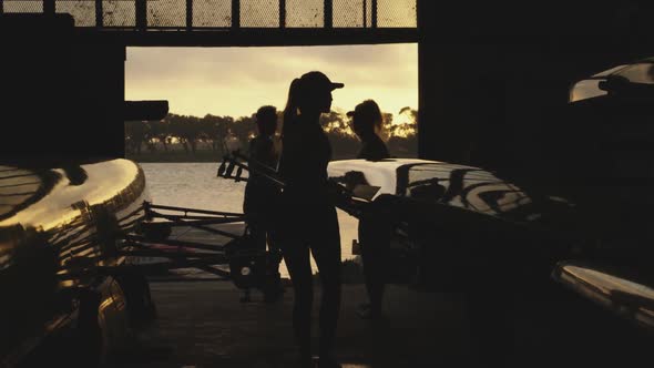 Female rowing team training on a river