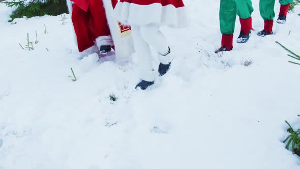 Tilt up of Santa and his elves dancing alt