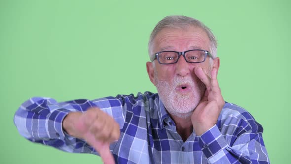 Face of Stressed Senior Bearded Hipster Man Getting Bad News