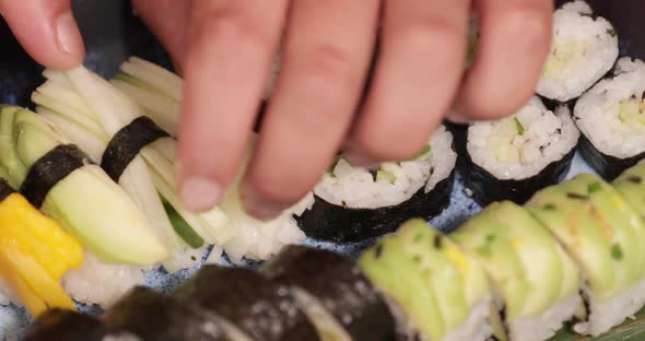 Set Of Sushi Rolls And Nigiri Sushi In A Japanese Restaurant. - close up shot