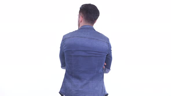 Rear View of Young Bearded Hipster Man Waiting and Thinking