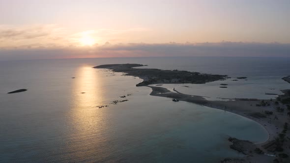 Elafonisi lagoon at Sunrise. Aerial view above sea. Flying over coast line