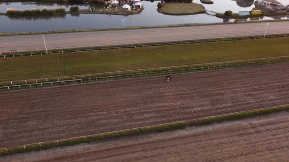 Horse and jockey after race at Palermo hippodrome, Buenos Aires in Argentina. Aerial top-down circli