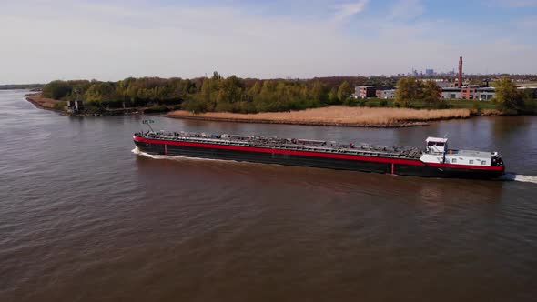 Tanker Ship Sailing In The Inland Waterway Of Netherlands. - aerial