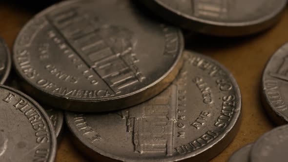 Rotating stock footage shot of American nickles (coin - $0.05) - MONEY 0188