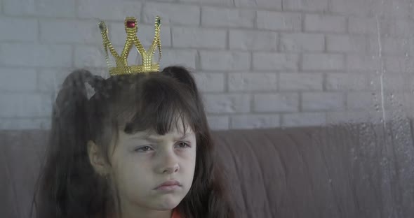 Sad Little Girl in Crown