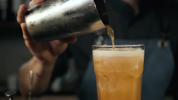 Young Professional Bartender Preparing Cocktails Outside Close Up Slow Motion Pouring Shaker