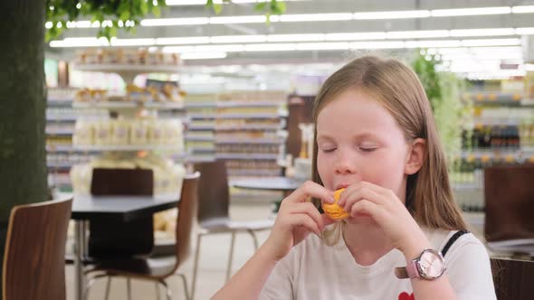 Girl Eating Pasta Cake in a Cafe.