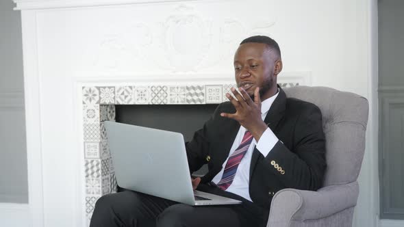 Young Black Business Man Communicating By Video Call