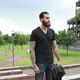 young beautiful bearded man posing outdoor looking away - VideoHive Item for Sale