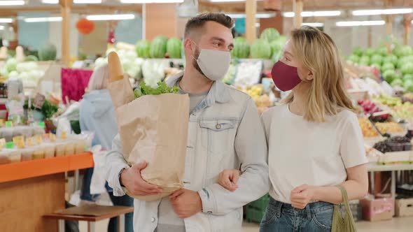 Couple in Face Masks Posing at Market