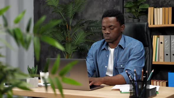 Confident African American Man Freelancer Works for Laptop Typing on Keyboard