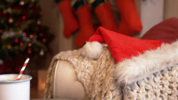 Santa hat and gingerbread with milk in living room