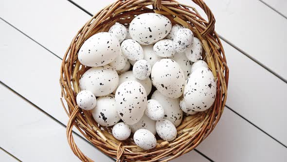 Basket of White Dotted Easter Eggs in Brown Wicker Basket